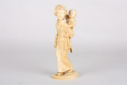 A late 19th century Japanese carved ivory figure of a mother and childfinely carved, the child