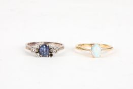 A 9ct gold and opal ringtogether with a small white metal, sapphire and diamond ring, Size K and