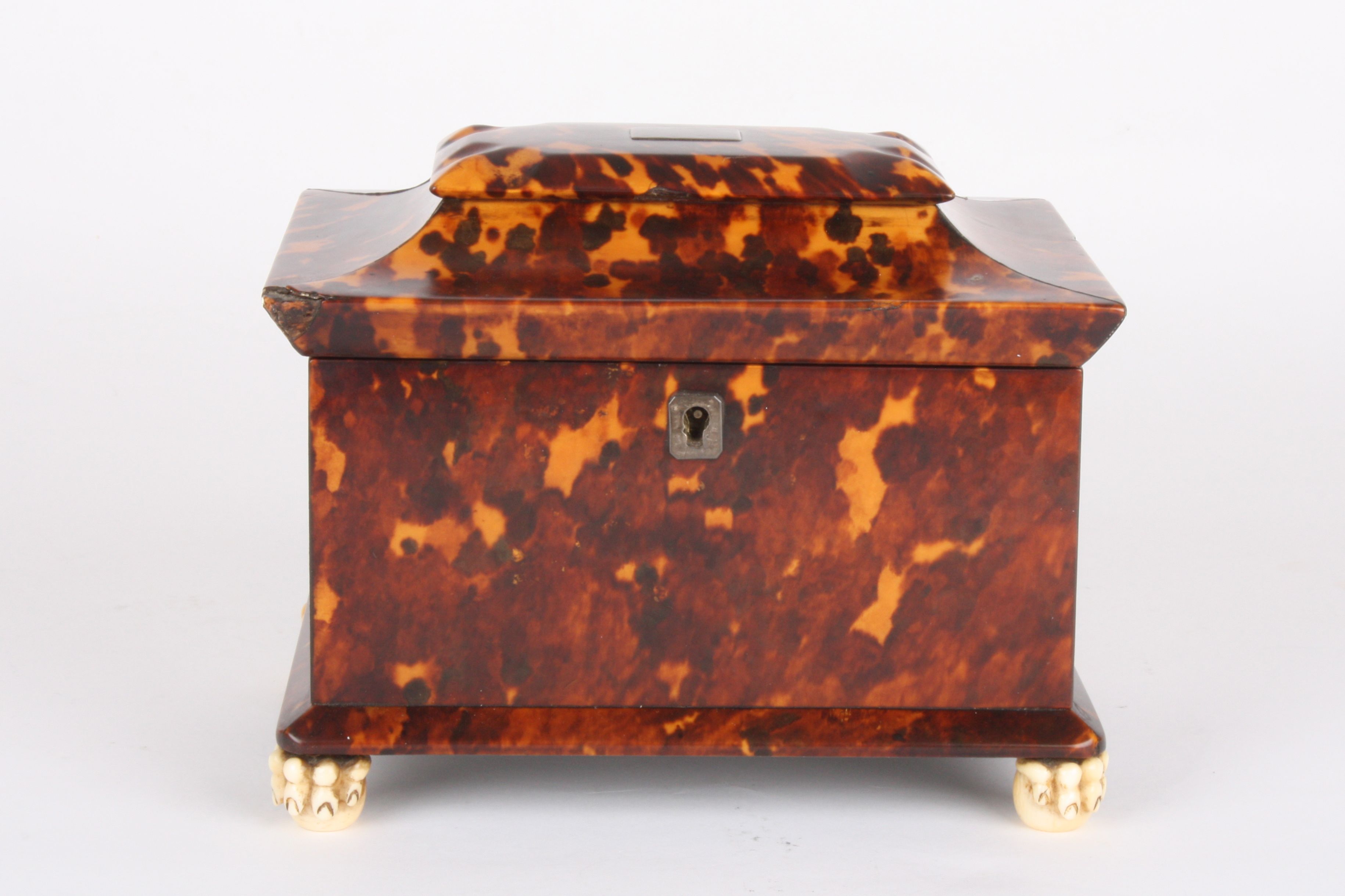 A Regency tortoiseshell tea caddy, 
with pagoda top and silver cartouche, the top opening to