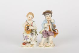 Pair of late 20th Meissen figures, modelled as gardening boy with trumpet and gardening girl with