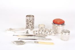 A collection of assorted embossed silver itemsincluding a Victorian silver box and cover, napkin