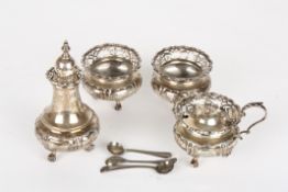 A Victorian four piece silver cruet sethallmarked London 1900 (2), 1902 and 1904, with squat bodies