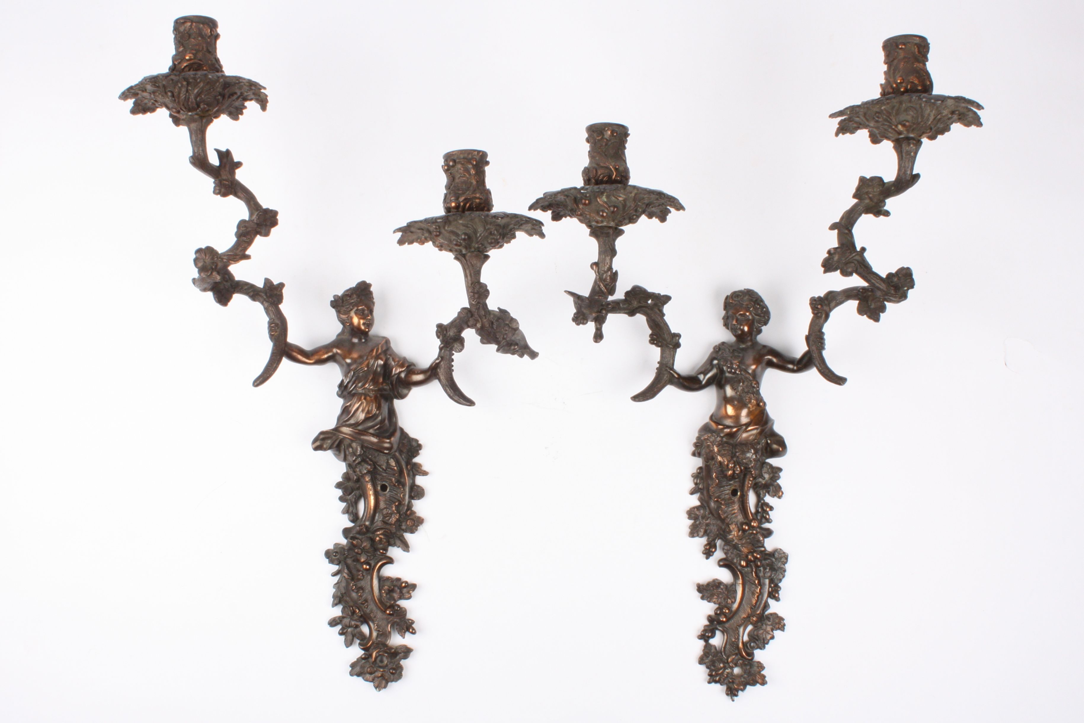 A large pair of early 20th century French brass two branch wall sconces
formed as cherubs holding