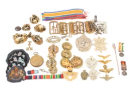 A collection of assorted RAF brass cap badges and buttonstogether with two South African medal