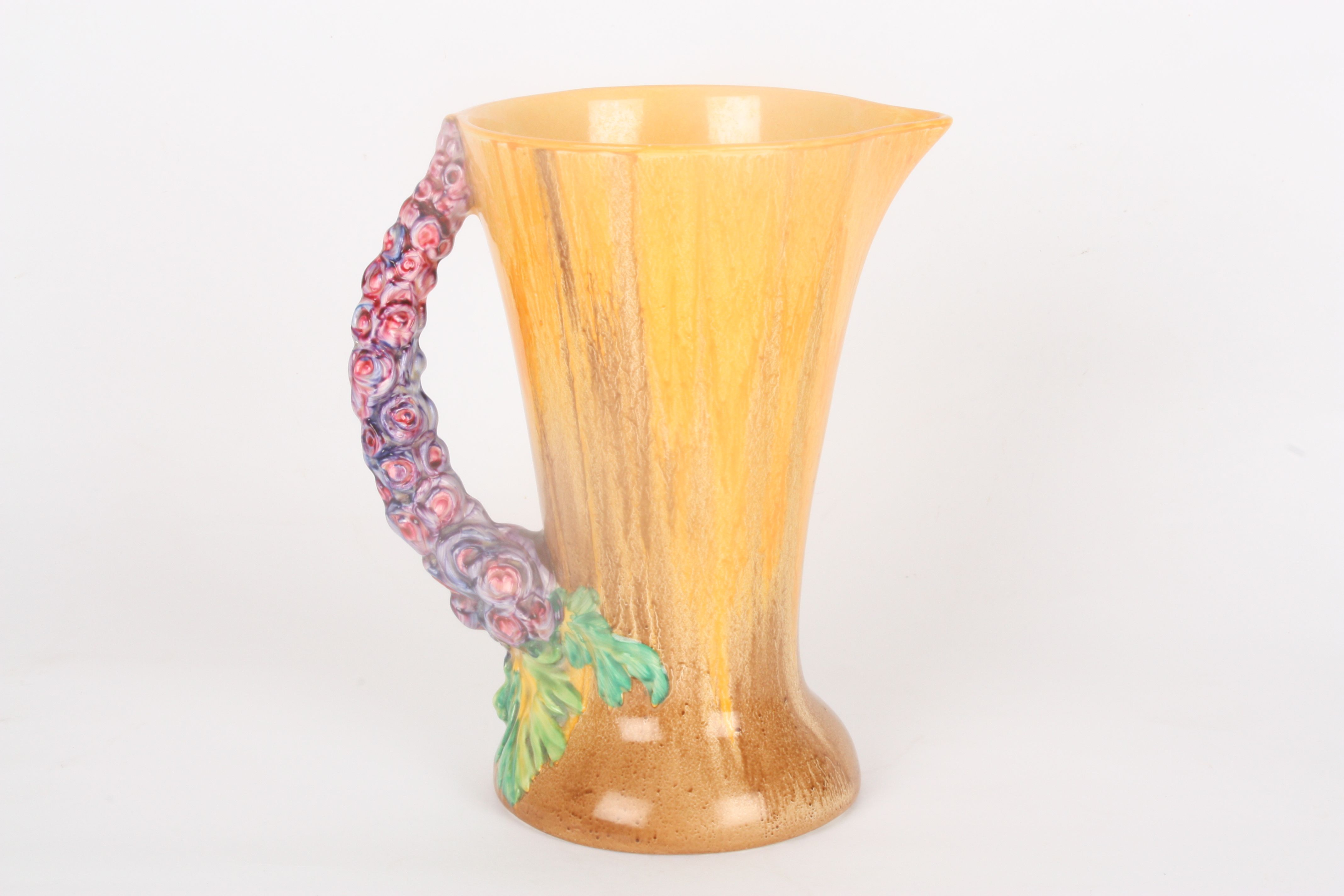 A Clarice Cliff My Garden jug
the orange and brown slip glazed body with moulded floral handle. - Image 2 of 4