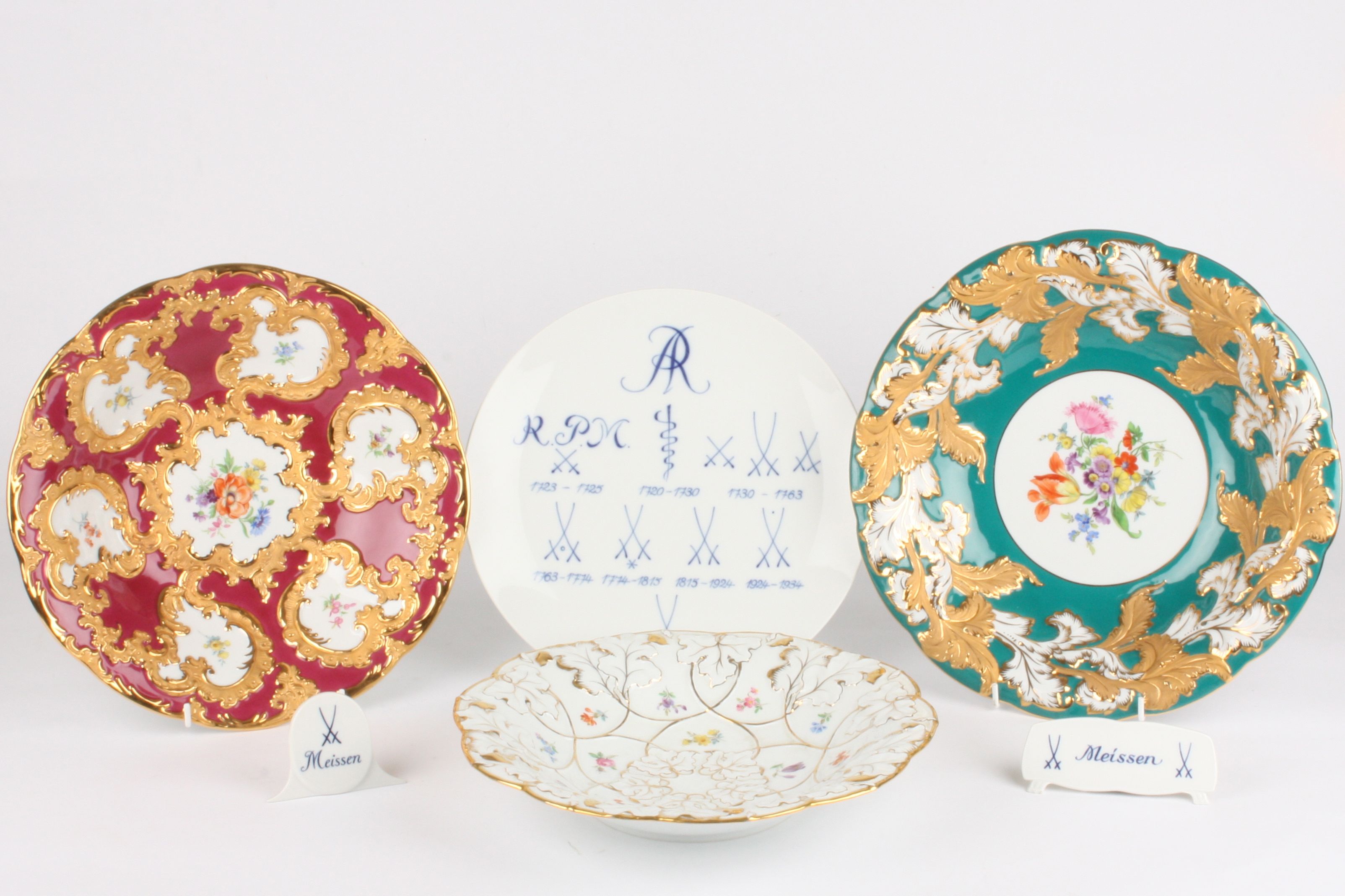 A collection of four late 20th century Meissen porcelain dishes all of different designs, painted