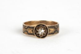 A gentleman's 19th century black enamel and yellow metal memorial ringset with old cut diamond