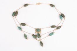 An Arts & Crafts turquoise and gold chain necklaceformed as oval turquoise beads strung in a