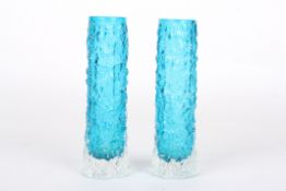 A pair of Whitefriars glass bark spill vases, in Kingfisher blue, of narrow cylindrical form, 14.5