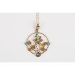 An Edwardian 9ct gold, seed pearl and turquoise pendant
formed as a flower head with leaves in a