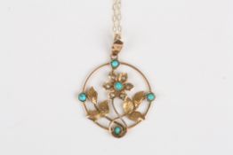 An Edwardian 9ct gold, seed pearl and turquoise pendantformed as a flower head with leaves in a