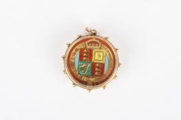 A Victorian enamelled sovereign type coin pendantwith Victoria bust one side and enamelled shield