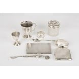 A collection of assorted silver items
including two engine turned cigarette cases, a christening
