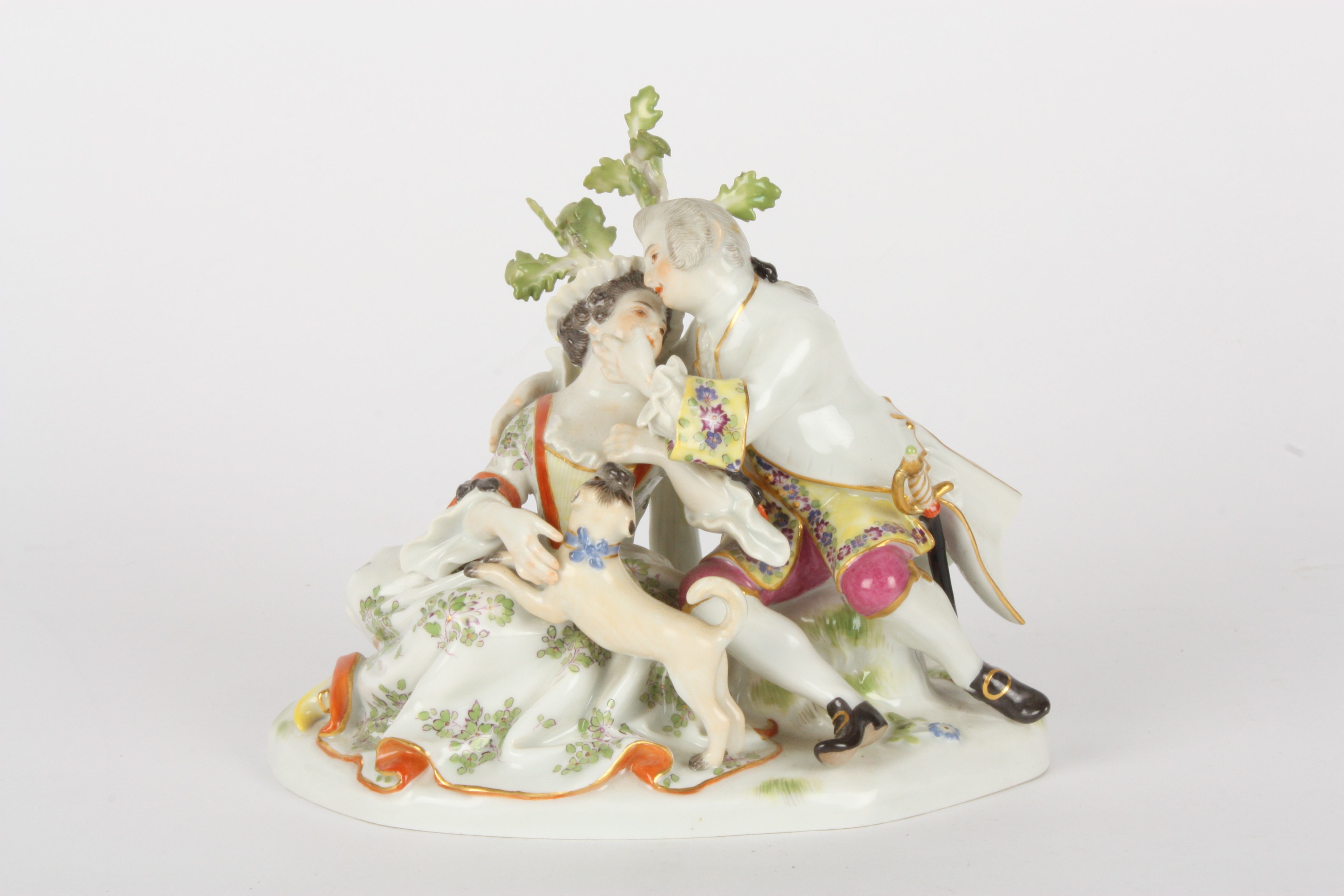 Late 20th century Meissen figure group, after Kaendler, courting couple seated, with a playful Pug