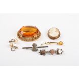 A collection of four costume jewellery brooches
together with a silver and gold bar brooch and a