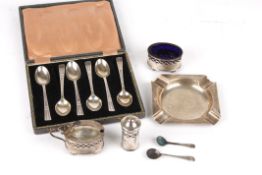 A small collection of silvercomprising a set of six coffee spoons in case, an ashtray and a