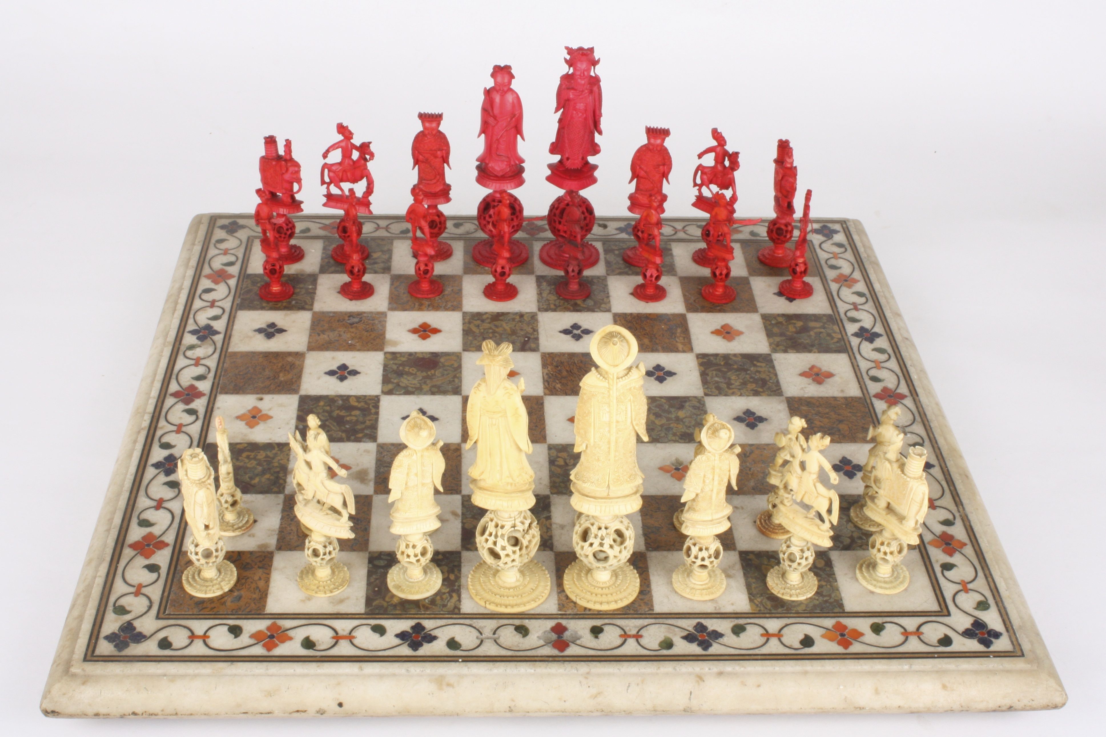 A Chinese carved ivory 'puzzle ball' figural chess set
Canton, early 19th century
one side of the