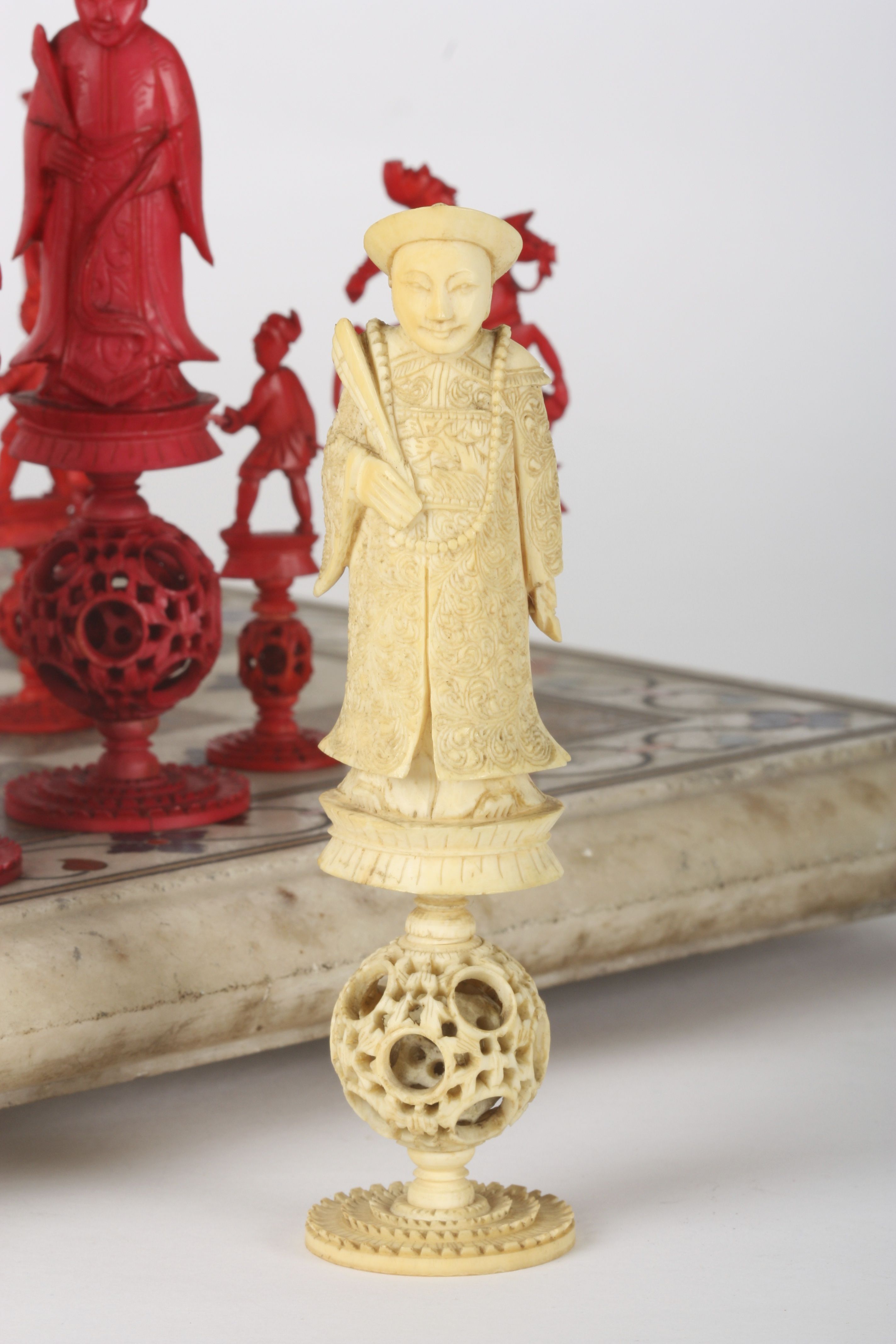 A Chinese carved ivory 'puzzle ball' figural chess set
Canton, early 19th century
one side of the - Image 6 of 6