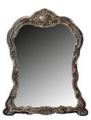A Victorian silver mounted easel mirrorhallmarked Birmingham 1899, ornately embossed with scrolls