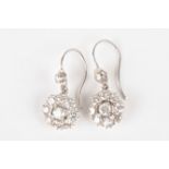 A pair of gold and diamond daisy cluster earrings
each central stone weighing approx 0.10cts,