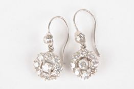 A pair of gold and diamond daisy cluster earringseach central stone weighing approx 0.10cts,
