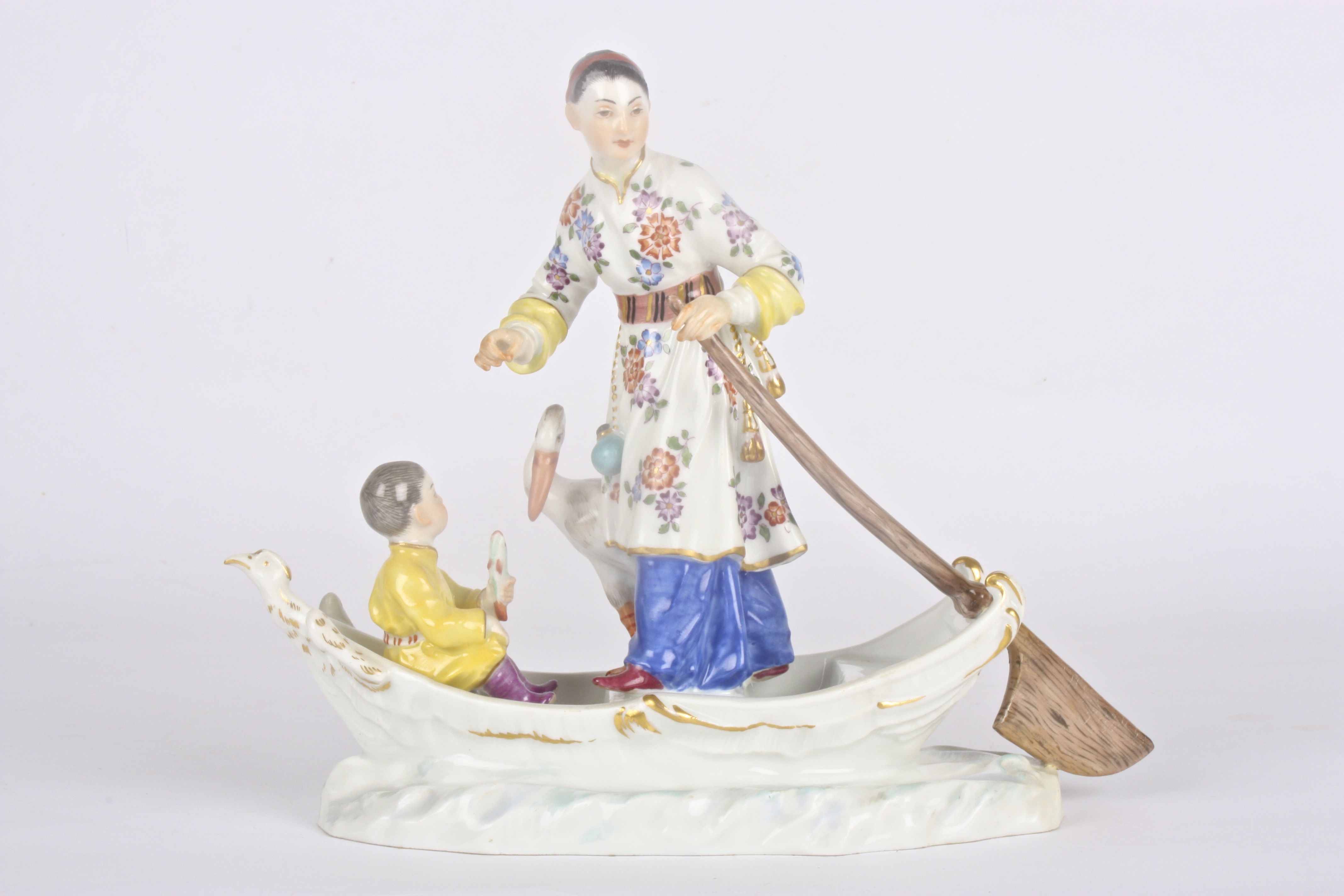 Late 20th Meissen figure group, after Kaendler/Reinicke, modelled as a Chinese lady rowing a boat