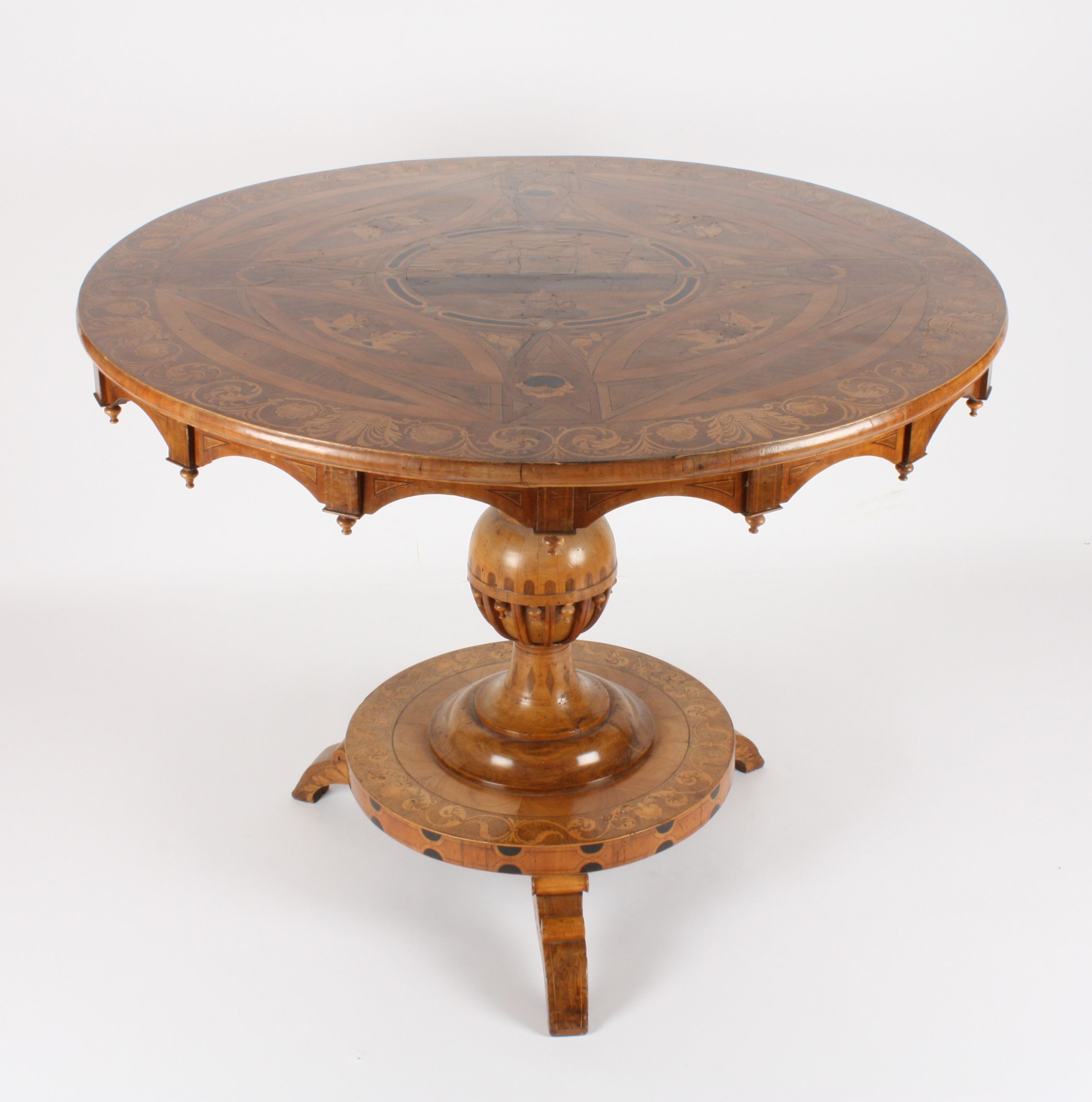 A good 19th century walnut marquetry tilt-top centre table with maritime interest
the centre