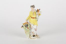 Late 20th century Meissen figure, modelled standing as a Japanese lady holding a basket of fish,