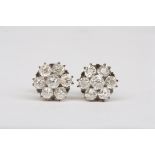 A pair of antique old cut diamond cluster earrings
each set with a central stone measuring approx