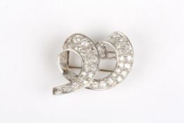 A diamond and white gold abstract scrolled broochset with two rows of diamonds, the largest