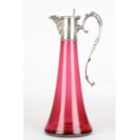 A silver plated and glass claret jug
late 19th century
the tapered cranberry coloured glass jug with