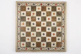 A 19th century Italian pietra dura chess board of square form inlaid with decorative floral motifs