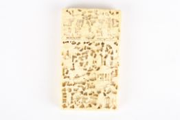 A late 19th century Chinese Canton carved ivory calling card caseintricately carved all over with