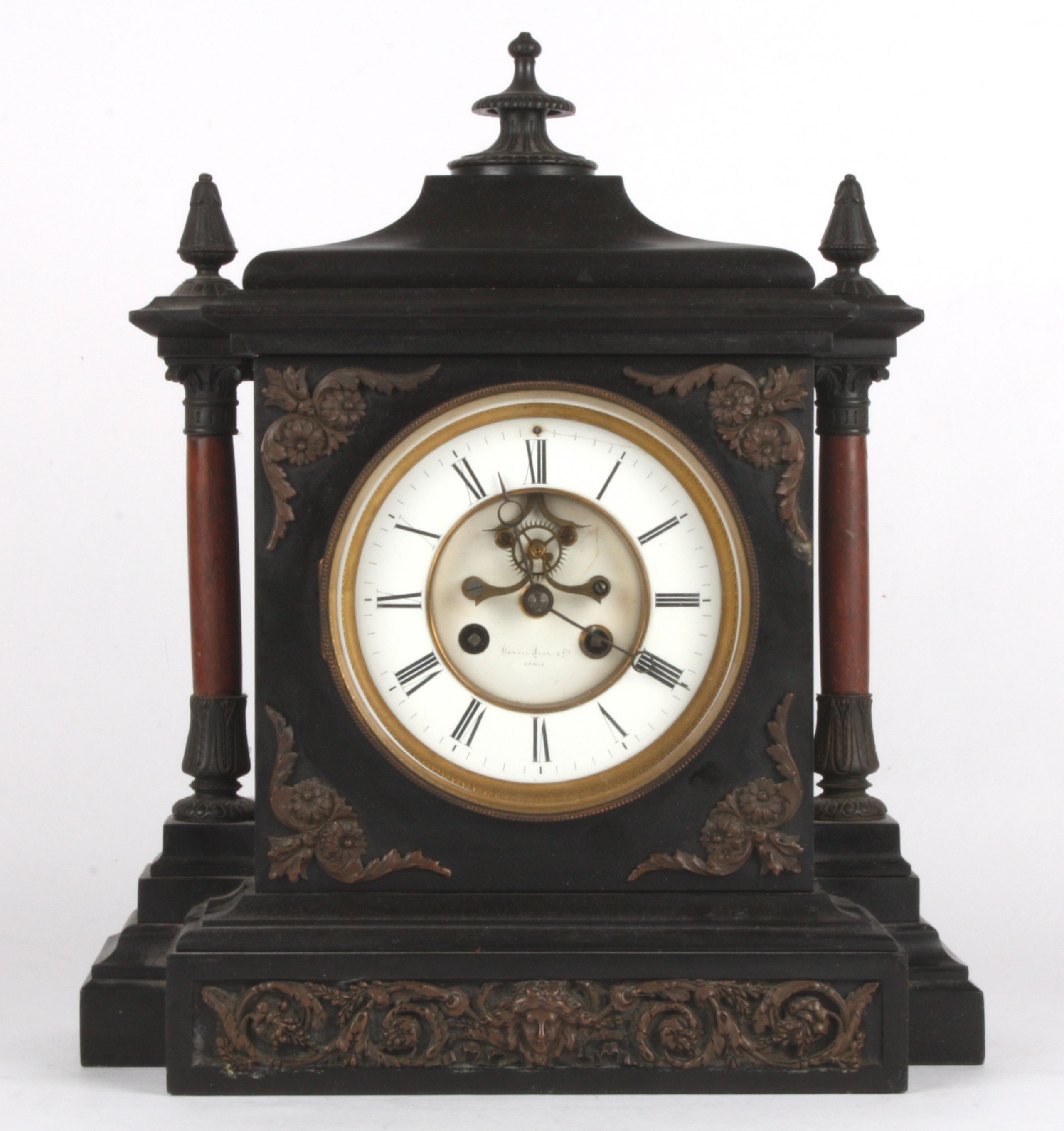 A French late 19th century red and black marble mantle clock
retailed by Howell & Jones
the 5 1/4