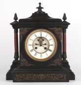 A French late 19th century red and black marble mantle clockretailed by Howell & Jonesthe 5 1/4
