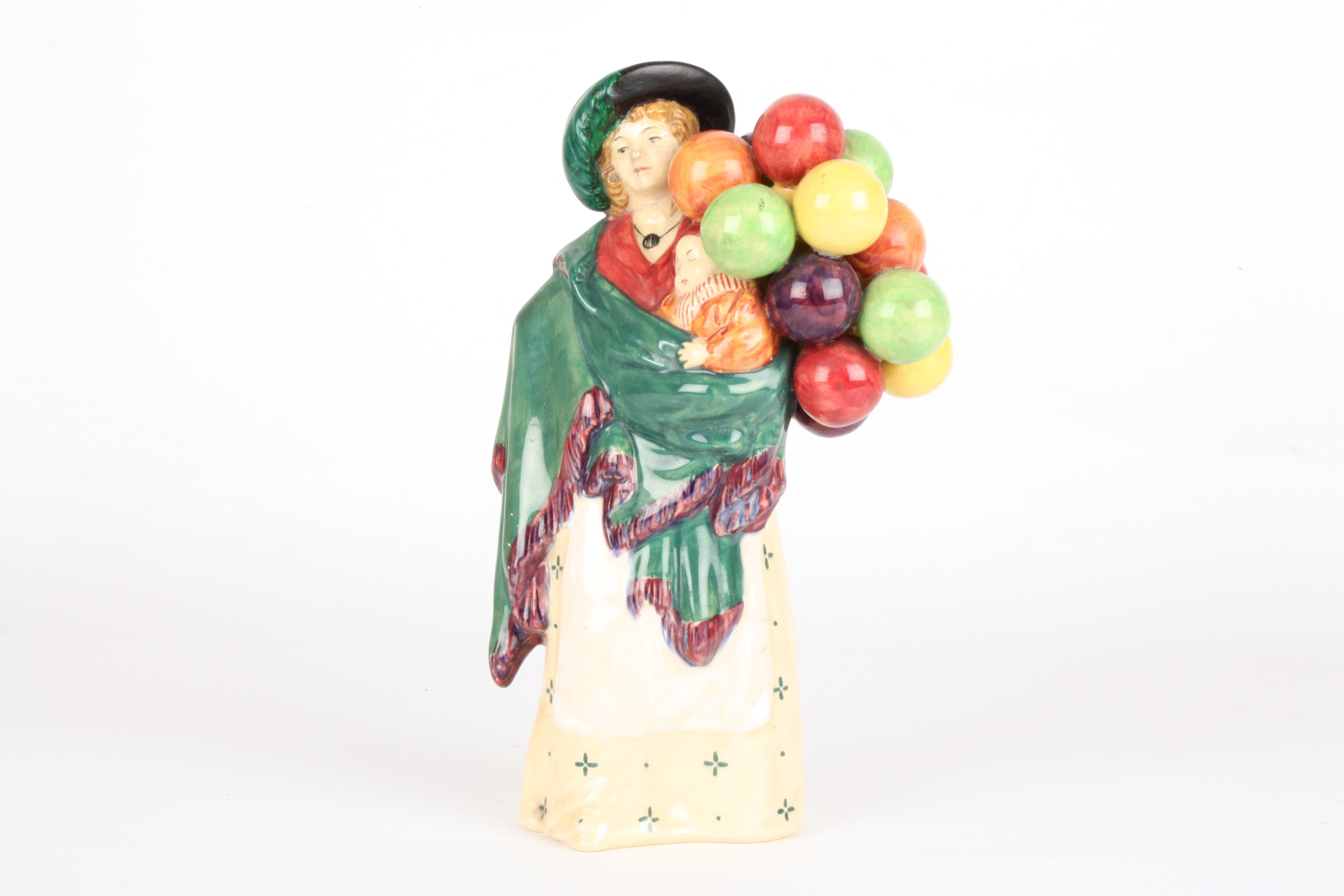 A Royal Doulton figure 'The Balloon Seller' HN 583, 23 cm high.Condition: Head extensively damaged