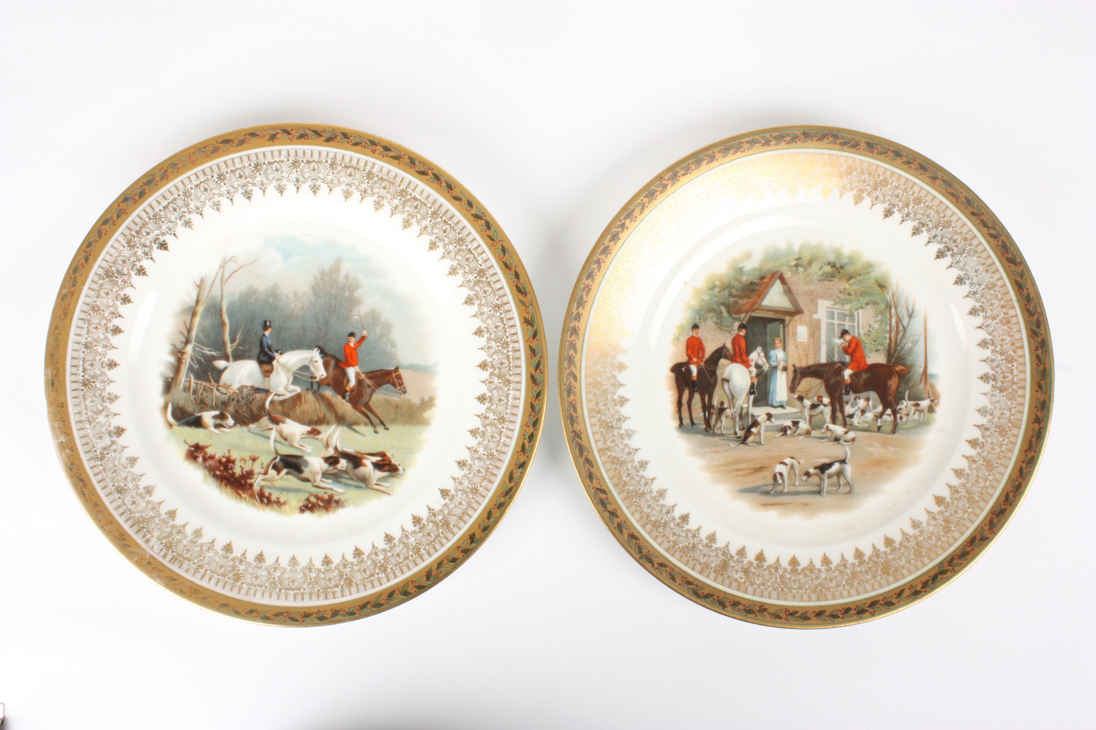 A pair of Vienna style painted plates decorated with hunting scenes
transfer printed and decorated