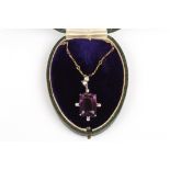 An early 20th century amethyst, diamond and gold necklace
with large rectangular amethyst surrounded