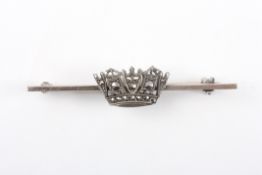 An early 20th century silver and marcasite bar broochformed as a crown on a plain bar, 3.7 grams.