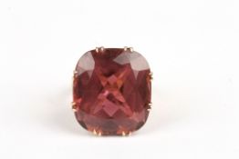 A large 56ct cushion cut pink tourmalinein a 9ct gold claw setting with later shank, 25 x 22 x 14