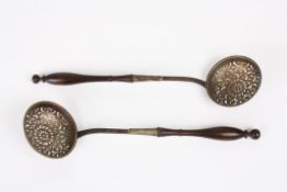 A pair of early 19th century white metal and wooden sifter spoonswith finely turned handles and