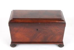A large Regency flame mahogany sarcophagus shaped tea caddy, with a pair of bronze wreath handles