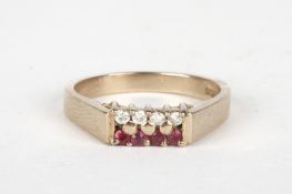 An 18ct gold gold, diamond and ruby ringset with a row each of four small diamonds and rubies, in a