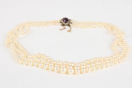 A triple row graduated cultured pearl necklacethe 3.5mm to 8mm pearls of uniform colour and