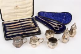 A small collection of silver itemscomprising two cruet sets, silver plated grape scissors and a box