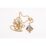 A sapphire pendant and chain
the emerald cut sapphire set in scrolled unmarked yellow gold, on an