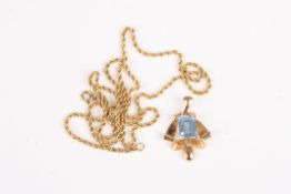 A sapphire pendant and chainthe emerald cut sapphire set in scrolled unmarked yellow gold, on an