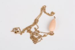 A coral pear shaped drop pendant necklacesuspended from a 9ct gold chain, Condition: Good