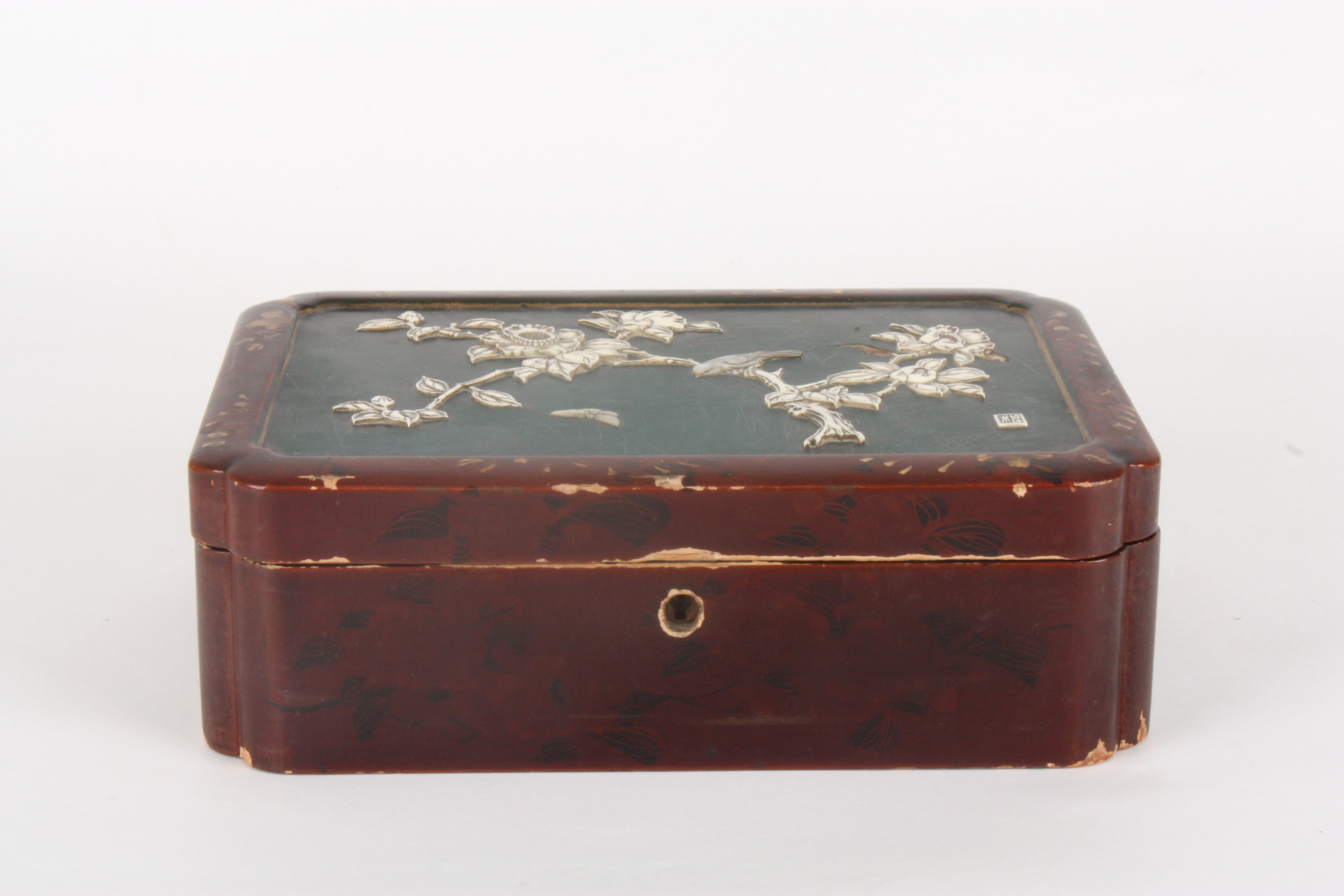 A Japanese red lacquer shibayama box and cover
the hinged lid inlaid with a bone and mother of pearl - Image 2 of 3