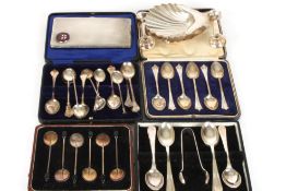 A small collection of silver comprising two shell shaped Mappin & Webb butter dishes, two silver